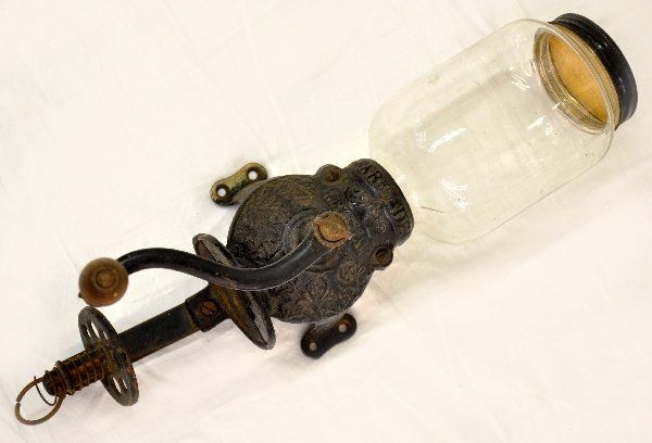 Early Wall Mount Coffee Grinder: Cast iron base, embossed Arcade Crystal. Clean with original top, just needs glass cup for receptacle. Shows light to moderate signs of use & age. Examine photos or call for more information, (203) 73