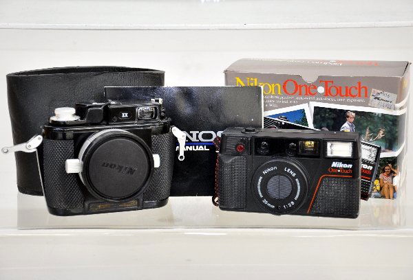 2 Vintage Nikon 35mm Cameras: Early Nikonos II underwater camera, missing bottom label, with instruction book; Boxed Nikon One Touch with paperwork. Examine photos or call for more information, (203) 730-1404.