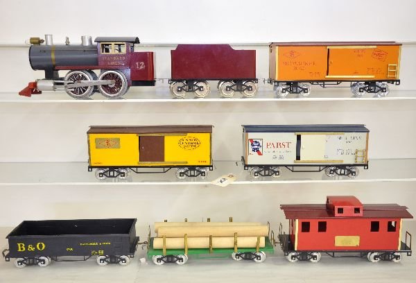 8Pc CMT Freight Set: ST. GA. By Charlie Wood. 12 Standard Line 0-4-0 tank loco & tender; MR boxcar; B&O gondola; NYC boxcar & Pabst beer car; lumber car & caboose, all show light to moderate playwear, C7-8