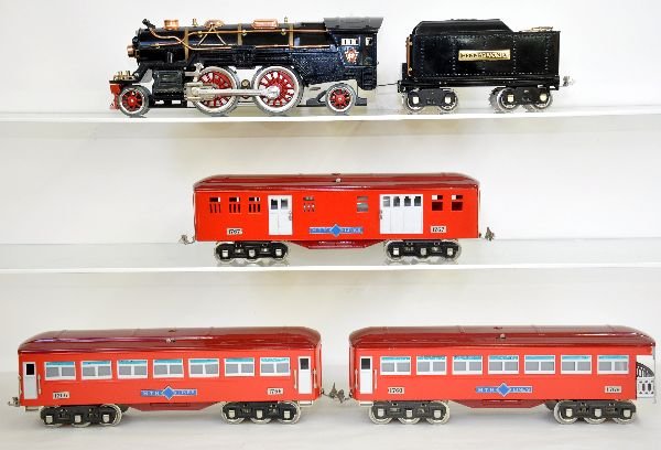 5Pc MTH Lionel 385E Passenger Set: ST. GA. Includes a reproduction of Lionel's 385E loco with 384T tender; it includes a set of MTH 1700 passenger cars with Lionel number plates installed. All show light playwear, C7+-8