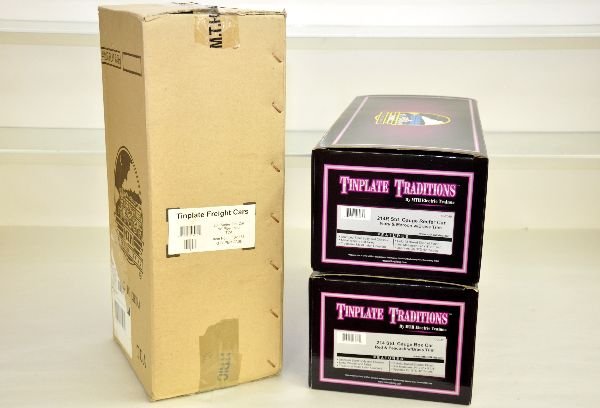 3 MTH Lionel 200 Series Freight Cars: ST. GA. 10-2049 #214R reefer Ivory/Maroon; 10-2038 #214 boxcar, red/peacock; 10-1158 flat with pipes for TCA, all are new in boxes with 2 shippers, C10