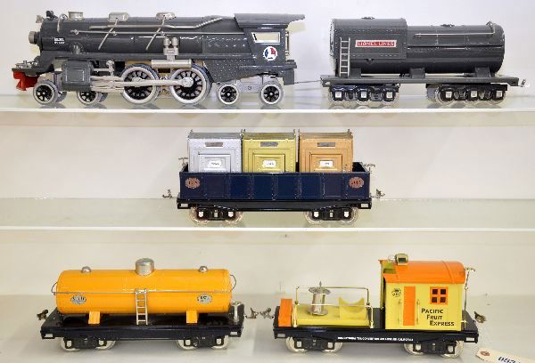 Lionel/MTH 400E Freight Set: ST. GA. Includes a Lionel 13108 I-400E. It actually has a warped frame just like many originals, very authentic. It comes with an MTH 200 series gondola with canisters, 215 tank car & PFE work caboose