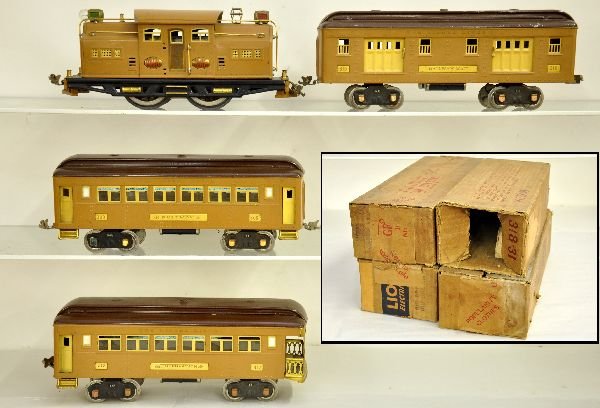 Nice Boxed Lionel Baby State Set: Original owner lot. ST. GA. 318E St. Paul style electric; 310 baggage; 309 Pullman; 312 observation. All are clean & shiny with boxes, showing light to moderate playwear, C7-7+