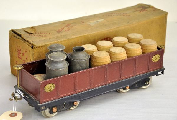 Boxed Loaded Lionel 212 Gondola: Original owner lot. ST. GA. Wine gondola with 8 split drums. Also included are 3 Buddy L milk containers, 1 missing top & a bag of period split drums from a cast iron toy dray. It shows light to moder