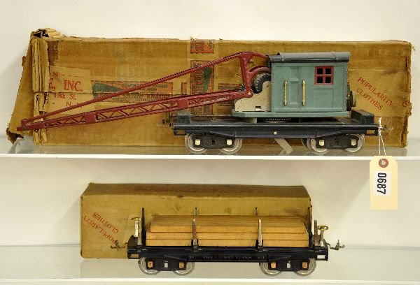Lionel 211 & 219 Freight Cars: Original owner lot. ST. GA. 211 lumber car; 219 crane, gears fatigued, missing hook. Both have boxes, crane is rough and otherwise shows moderate playwear. Should otherwise clean to C6+-7