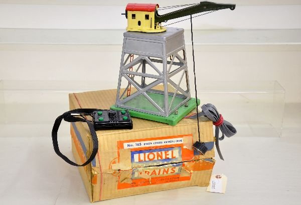 Boxed Lionel 165 Magnetic Crane: Bright silver with great roof. A bit dusty, missing hook, but rewired showing light playwear with box, otherwise C7