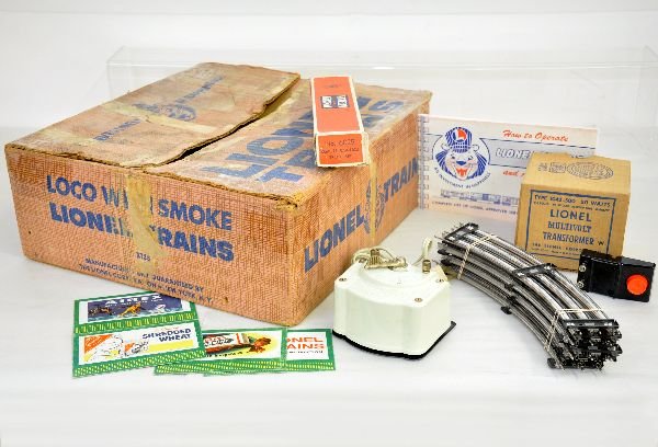 Boxed Lionel Girls Set, Part 7: This lot contains the boxed 1043-500 white transformer, catalog, some track & X738 pink setbox for the Sears Girl's set. The transformer as a supple cord and the setbox is worn & taped.