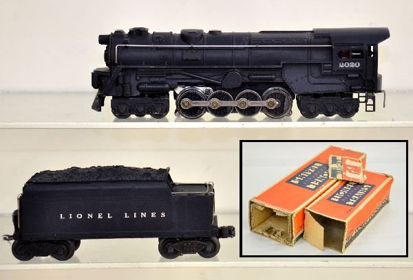Boxed Early Lionel 2020 PRR Turbine: Early version with smoke bulb & red atomic motor plate, nose decal is 85%; later 2020 tender. Both show light to moderate playwear with rough boxes, C7
