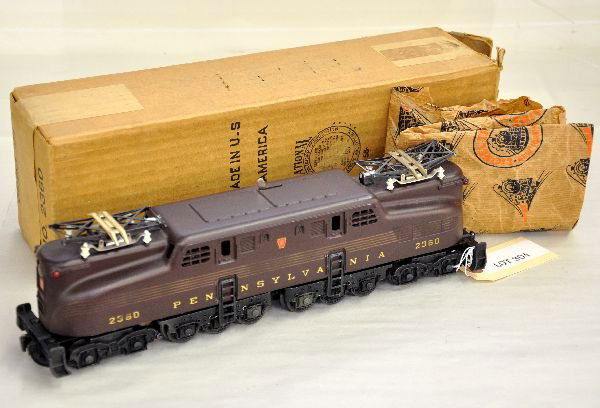 Boxed Lionel 2360 PRR GG1: Nice Tuscan Congressional loco with 80% stripes over-all. It has a nice matte patina, showing light run time with wrapping & worn box, C7