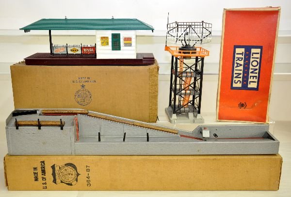 3 Boxed Lionel Accessories: 256 freight station; 197 radar tower, tougher orange top with whip antennae; 364 lumber loader. All show light to moderate playwear with boxes, C7-7+