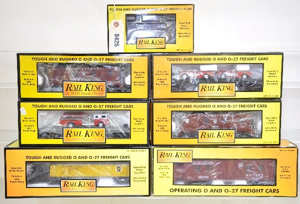 7 MTH RailKing Freight Cars: 30-77070 caboose; 7722 caboose; 7218 snow plow; 7624 auto-loader; 7715 caboose; 7629 flat with fire truck; 2124 snow plow, all appear lightly run with obs, C8-9