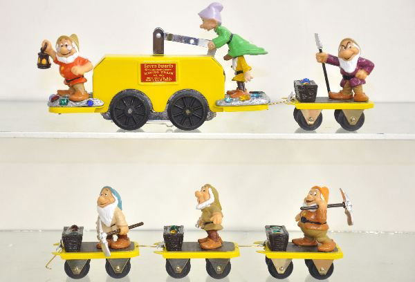 Pride Lines Snow White Handcar Set: One of their best sets including a handcar & 4 trail cars with the 7 Dwarfs. It originally came with a display board, which is missing, but has the Snow White figure with 1 paint chip on bottom. Over-