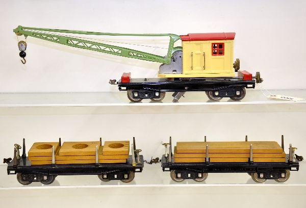 3 Lionel 200 Series Freight Cars: Standard Gauge. Two 211 lumber cars, one C6 other C7+; restored 219 in mid period colors.
