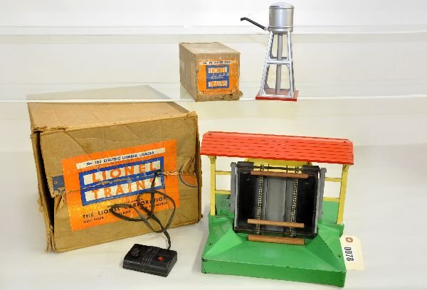 Boxed Lionel 164 & 93 Accessories: 93 water tank, clean with 100% decal; 164 lumber loader, 1942 version with 92 gray superstructure. Includes controller with rusty back, missing roof finials & worn original box. Both show light playwe