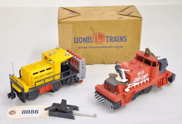 Lionel 54 & 52 Motorized Units: 52 fire car, complete, but has some rust spots on chair base; 54 ballast tamper with trip & nice ob. Both otherwise show light to moderate playwear, C7