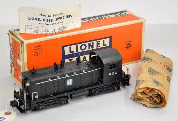 Nice Boxed Lionel 623 SF Diesel: Very clean with nice handled patina. Decals are 100% with 10 handrail stanchions. Shows light playwear with wrapping, insert & original box, C8
