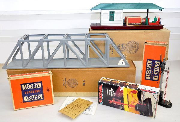5 Boxed Lionel Accessories: Includes 317 trestle bridge, tab off 1 cross sport; 356 operating freight station with cart box, scarce red cart; 151 semaphore; 310 billboard set, cards loose; 12729 mail pick-up set, new in box. Oth