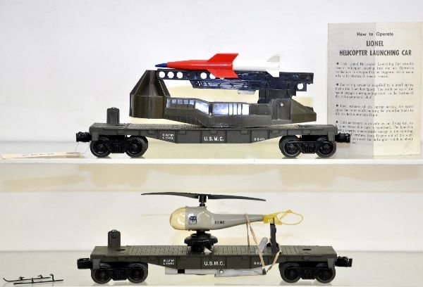 Lionel 3429 & 6640 USMC Military Cars: 3429 operating helicopter with original USMC copter. It has a small crack near rotor and skids and tail are incomplete; 6640 ICBM launcher with 2-color rocket. Otherwise, both show light to moderate p
