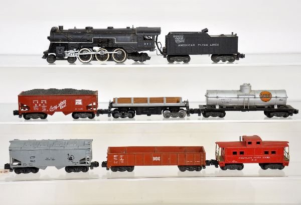7Pc American Flyer 293 Steam Freight Set: S Gauge. Late 293 NYNH&H Pacific with coal pusher; 924 JC Cement car; 9421 Frisco gondola; 921 CB&Q hopper; 914 Log dump car with load; 925 Gulf Tank; 938 caboose. All show moderate playwear & should 