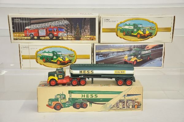 5 Boxed Hess Trucks: 1970s Marx tank truck, some battery residue, but very cleanable, C6+; 2 -1984 Hess banks; 1982 tank truck; 1989 Fire Truck. Otherwise all are like new with boxes & insets, C9