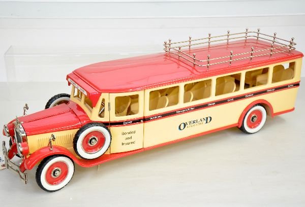Boxed Retro Buddy L Overland Bus: Fantastic reproduction pressed steel bus. Has interior & motor details with rubber tires. It is 29" long and like new in box with shipper, C9