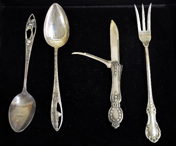 Sterling Silver Group: 2 blade pocket knife; International Oyster fork, wild rose pattern; Washington DC pierced spoon; Miami, Fla. Pierced spoon. All embossed with hallmarks and sterling. Overall 2.43oz. Examine photos or 