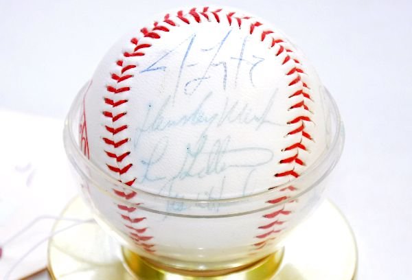 Signed Yankees Baseball: Yankees Taiwan ball including signatures by Tony Kubek, Jim Leyritz and nine others. All signed in blue marker that is slightly faded, ball is white with holder. Examine photos or call for more inform