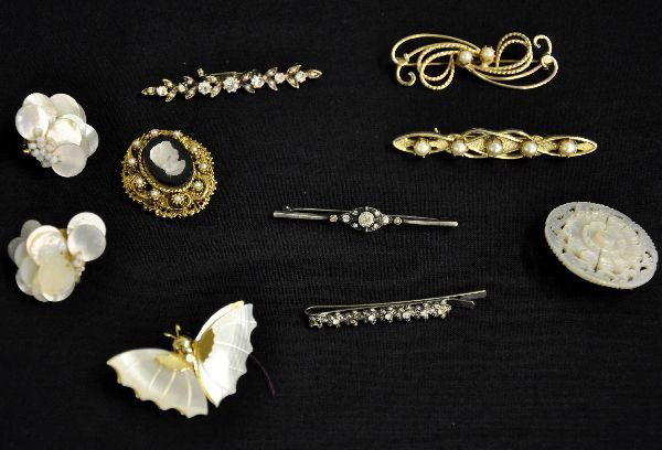 10Pc Vintage Costume Jewelry Lot: Includes two 1930s bar pins; 2 later bar pins; marcasite tie clip, missing 2 stones; mother of pearl style earrings, butterfly pin, pierced round pin and pretty cameo on pearl encrusted pierced base w