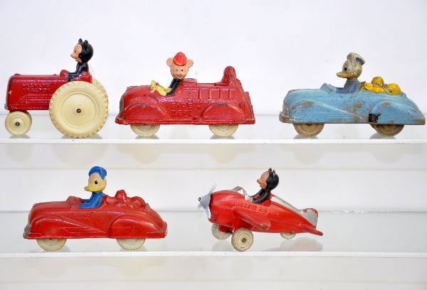 5 Sun Rubber Disney Vehicles: Unusually nice for hard rubber. Includes Mickey Mouse Plane, Tractor & Fire Engine; 2 different Donald Duck & Pluto Roadsters. All show light to moderate playwear, C7-7+