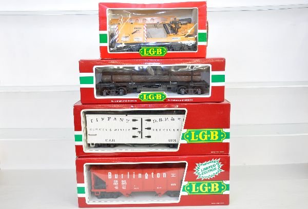4 LGB Freight Cars: 4042 crane; 42660 log flat; 4076 M01 hopper; 4074 B02 reefer. All have boxes, crane shows wear, with 3 sleeves, C7-7+