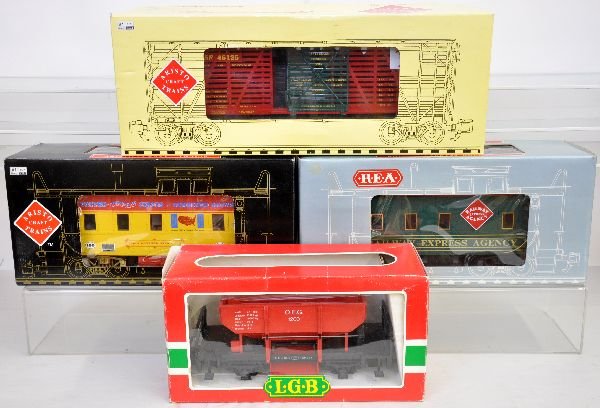 4 G Gauge Freight Cars: Includes LGB 4041 ballast car; AristoCraft Cabooses include 42127 Polkas Circus; 42105 REA & a 46125 Christmas stock car. All show light playwear with boxes, C8