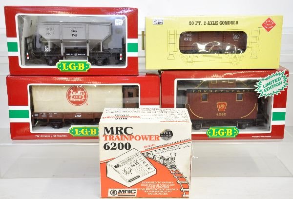 5 Pc G Gauge Lot: Includes MRC 6200 transformer; AristoCraft 40001 gondola; LGB 40130 covered flat; 41410 ballast car; 4065 E PRR bobber caboose. All show light playwear with boxes, C8