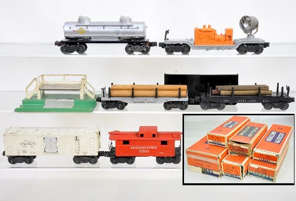 6 Boxed Early Lionel Freight Cars: Includes 2472 caboose; 6520 searchlight; 2465 tank car; 6462 milk car & platform, no cans, brass mechanism; 3459 coal dump with bin; 2411 log flat. All show light to moderate playwear with boxes, some