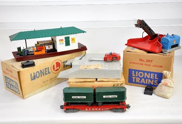 Boxed Lionel 356, 397 & 460: 356 operating freight station with worn -35 box; 397 coal loader with 206 & 364c; 460 piggy-back platform that has the tough variation with "Boss Trail loader" decals. It is missing the loader tires, 
