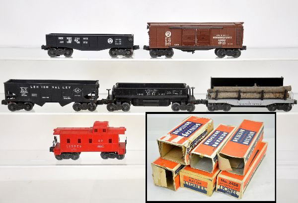 6 Boxed Lionel Early Freight Cars: Includes 3459 coal dump with bin & insert; 2452 gondola; 2458 PRR boxcar; 2257 caboose with insert; 2411 flat with replaced load; 2456 LV hopper. All are clean with worn boxes, C7