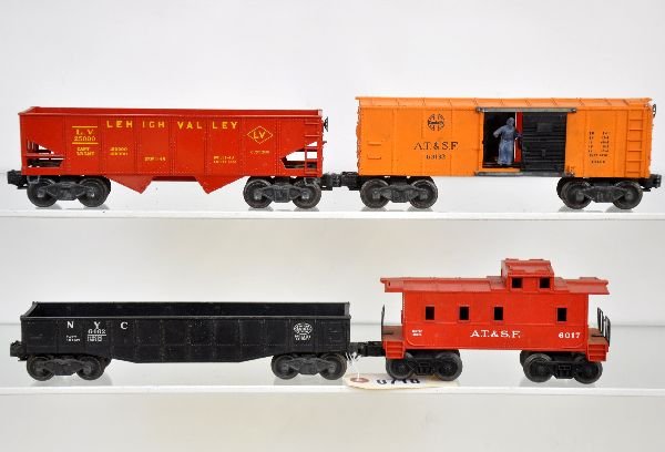 4 Lionel Freight Cars: Includes clean 6456-75 LV hopper, gloss red with yellow, minor ladder nick, 1 side; 6017-235 AT&SF caboose; 3462 SF operating Boxcar; 6462 gondola. All otherwise show light to moderate playwear, C7-7+