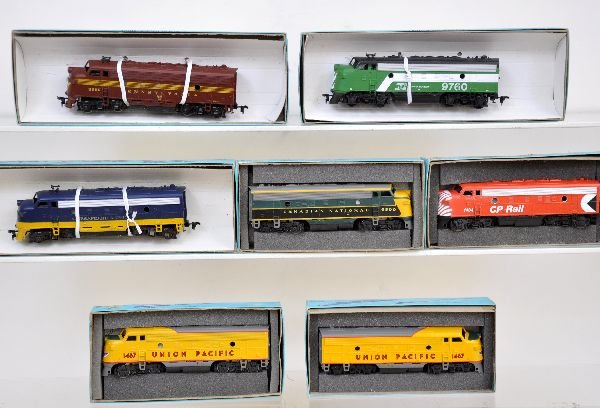 7 Athearn HO Diesels: 6 Assorted road name F7A powered. One BN F7A dummy. All appear unrun in musty boxes, C8
