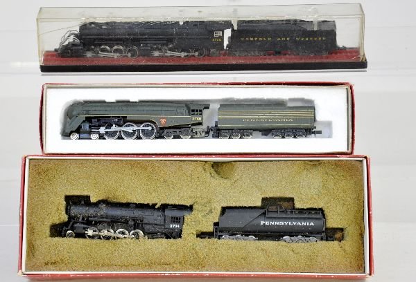 3 Boxed N Gauge Locomotives: Includes a RivaRossi PRR Mikado, foam worn; Con-Cor PRR J3a Bullnose; Germany, MRC N&W Mallet with worn display box. All show light playwear with boxes, C8