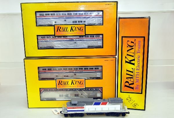 MTH RailKing Amtrak Passenger Set: Includes RK2003 Dash-8 diesel with horn, box graffiti; 30-6500 Superliner 4-pack, obs; 30-6501 sleeper/diner set, ob mildewed. All show light run time, C8