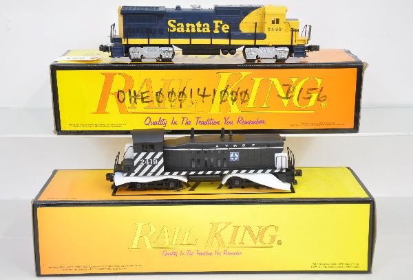 2 MTH RailKing SF Diesels: Includes 30-2115-0 Dash-8 with whistle, box graffiti; 30-2156-0 NW-2 diesel with horn. Both show moderate runtime with boxes, but bodies are C8. Some boxes in this lot may have light to moderate basem