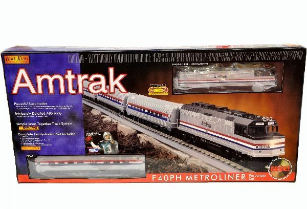 MTH RailKing 30-4025-1 Amtrak Set: Includes an F40PH diesel with 3 Metroliner streamline passenger cars, track (has minor oxidation spots) & transformer. The set is unrun, but the box has a strong odor of basement. Trains are otherwise