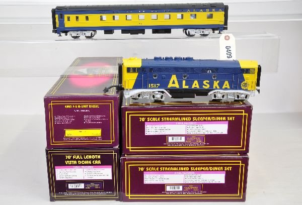 MTH Alaska Trains Lot: Includes 2128LB F3 B-Unit; 20-6718 full vista-dome; 2 #20-6818 sleeper/diner sets. All appear to be lightly run with boxes, C8. Some boxes in this lot may have light to moderate basement smell