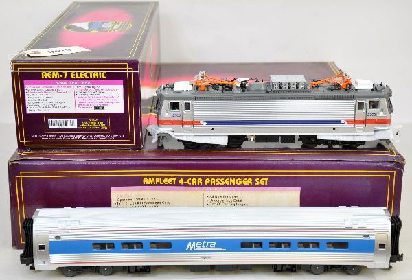 MTH Amtrak Amfleet Train Set: Includes 20-5506-1 Septa REM-7 electric with dual motors, lighted cab interior & ProtoSounds, lightly run, C8; 20-6520 5-car Metra Amfeet cars that are unrun with boxes C9. Some boxes in this lot may
