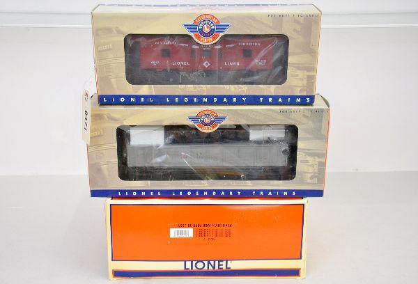 Lionel Freight Cars: Includes 21761 B&M 4-pack boxcars; 19877 operating Celebration barrel car; 19756 Celebration Erie bay window caboose. All are unrun with boxes, C9. Some boxes in this lot may have light to moderate ba
