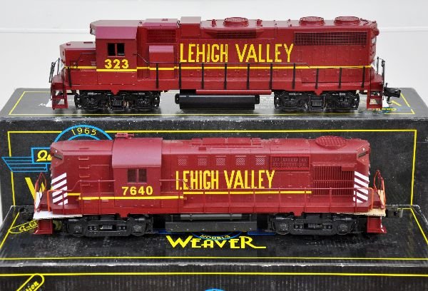 2 Weaver LV Diesels: Ultra Line GP38-2 with dual motors; RS11 Alco with dual motors and sounds. Both show light run time with boxes. Boxes have light musty smell, C8+. Some boxes in this lot may have light to moderate bas