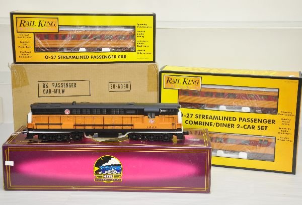 MTH MR Diesel Passenger Set: Includes 20-2202-1 Dual motor FM diesel with ProtoSounds; RailKing 30-6090 4-car streamline set & 30-6091 combine/diner set. All appear unrun with boxes & 1 shipper, C9. Boxes in this lot may have lig