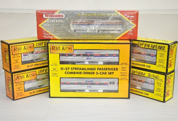 MTH Williams Amtrak Passenger Set: Includes a Williams SD-45 diesel, factory sealed in mildewed box, C10; RailKing 6001, 2, 3 & 4 streamline passenger cars ; plus the 30-6004 combine/diner set. All appear unrun with boxes, 4 have graff