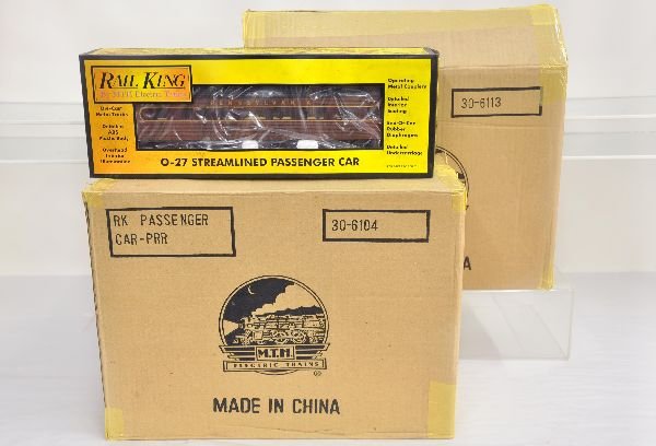 2 MTH RailKing Passenger Car Sets: Includes 30-6113 NYC streamline 4-car set & 30-6104 PRR Streamline 4-car set. All are unrun with dusty boxes & shippers, C9. Boxes in this lot may have light to moderate basement smell