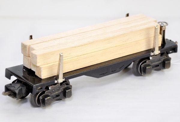 Scarce Madison Hardware 2651 Lumber Car: Unusual war production piece, made by Madison. It is stamped underneath, 2651. It is clean & shiny with 1942 couples. The load is balsa and looks great, C8