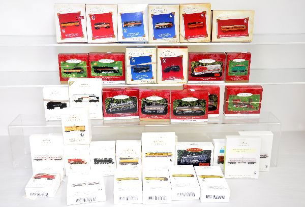 35 Hallmark Lionel Ornaments: All are boxed, with several sets, but a few are missing the inserts. Highlights include 4pc City of Portland; 4Pc Freedom Train; 1872 & tender; 701 & tender; 726 & tender; UP turbine & tender; 2332 GG